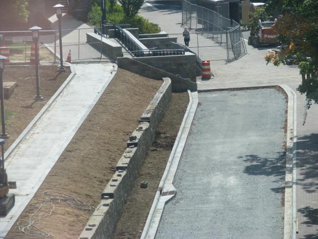 Road and sidewalk divided by retaining wall