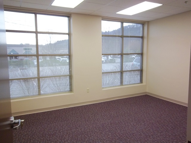 Newly finished empty room with large windows