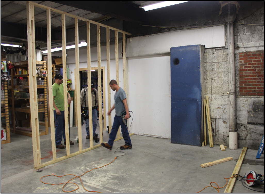 Framing of a wall being set up inside office