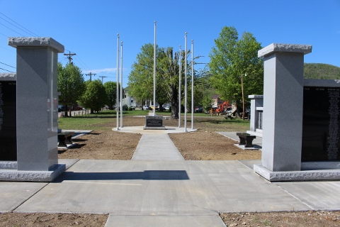 Forward facing view of concrete pillars surrounding memorial