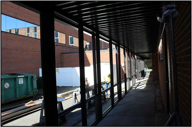 Sidewalk outside of medical building with covered walkway for weather protection
